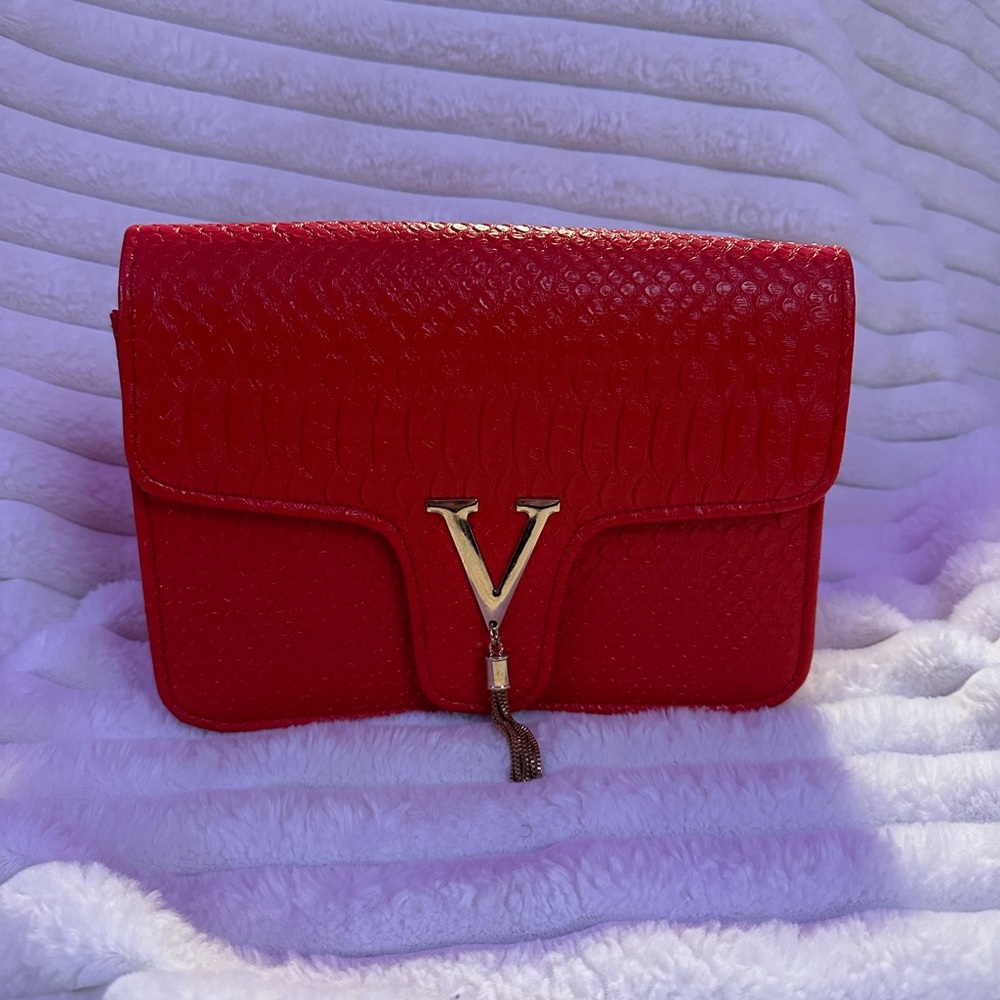 Red clutch bag with chain strap